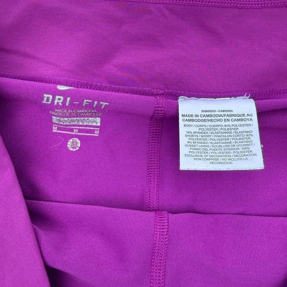 Nike purple tennis skort with diagonal stripes in shades of purple, size M